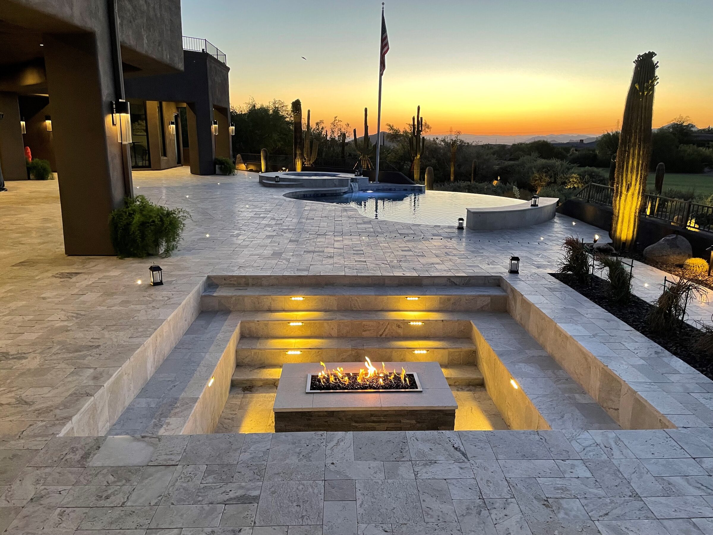 Infinity edge pool with hillside views and luxury outdoor living space