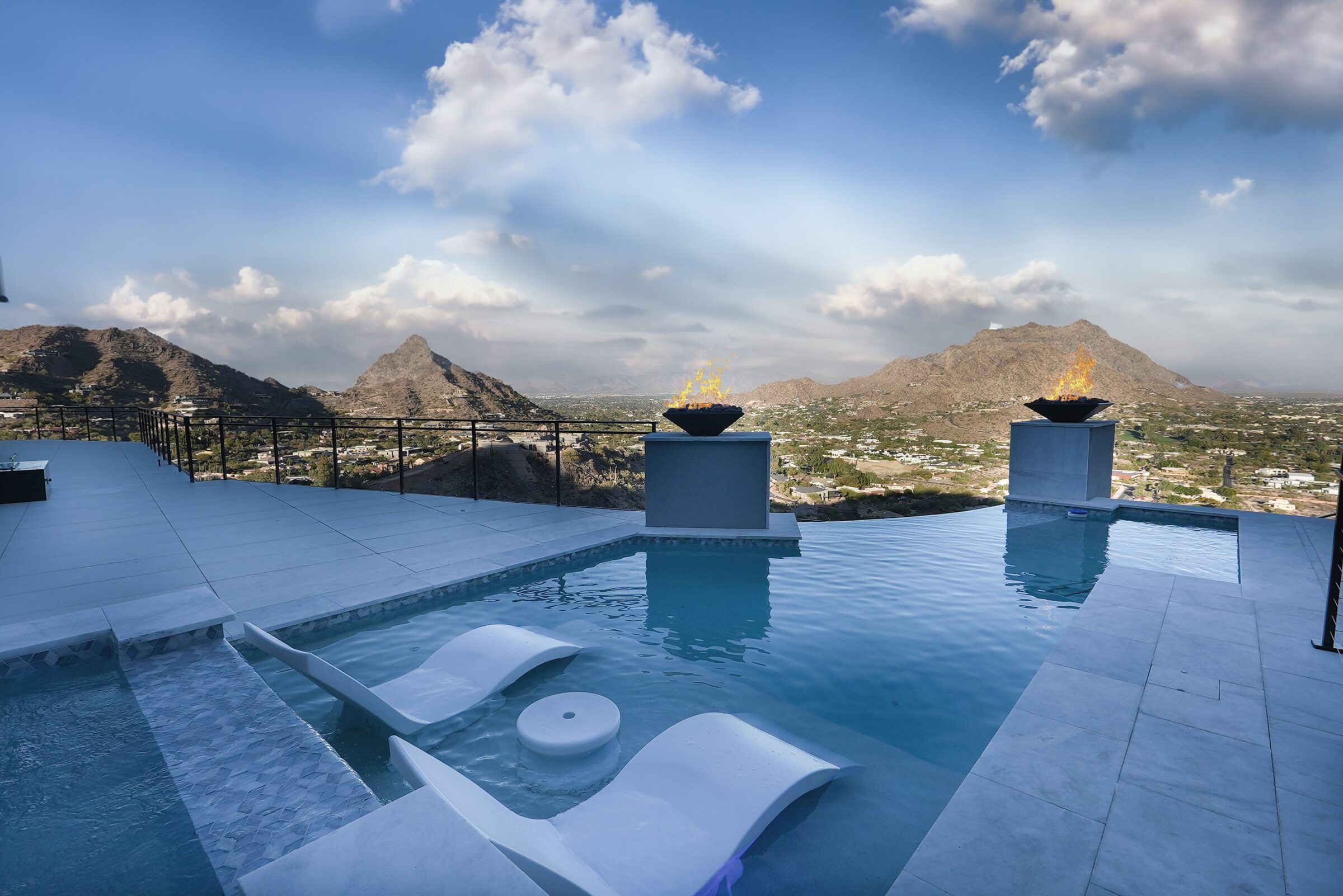 Scottsdale hillside infinity pool with panoramic mountain views and fire features